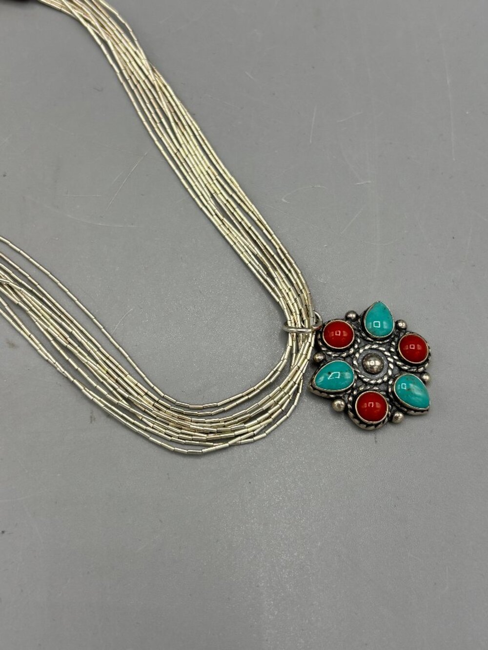 Turquoise & Coral Pendant on multi strand necklace